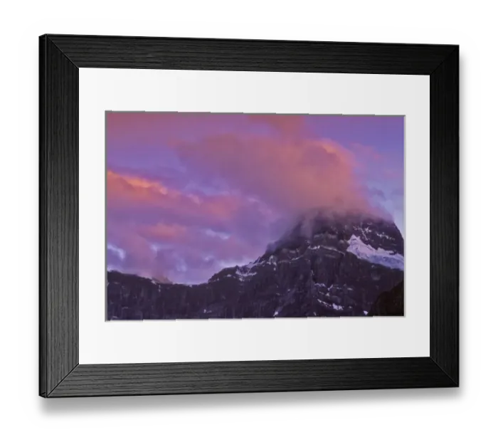 Framed Print : Canada, Alberta, Baniff National Park. Sunrise-colored clouds hang on a mountain peak Framed Print : Canada, Alberta, Baniff National Park. Sunrise-colored clouds hang on a mountain peak
