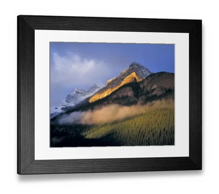 Framed Print : Canada, Alberta, Banff NP. Sunrise strikes the flank of the Canadian Rockies as clouds Framed Print : Canada, Alberta, Banff NP. Sunrise strikes the flank of the Canadian Rockies as clouds
