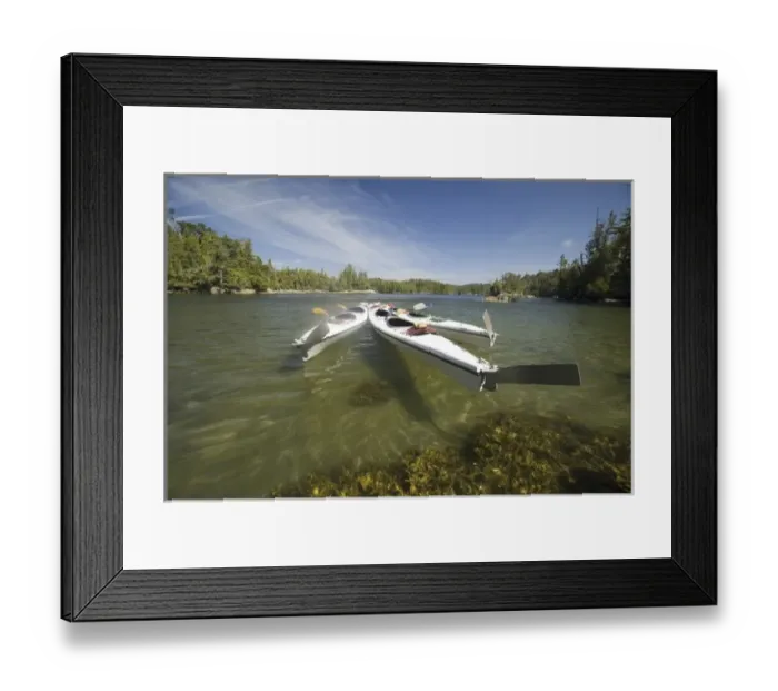 Framed Print : Kayak Fleet at Rest During Late Afternoon at Skull Cove, Bramham Island, British Columbia