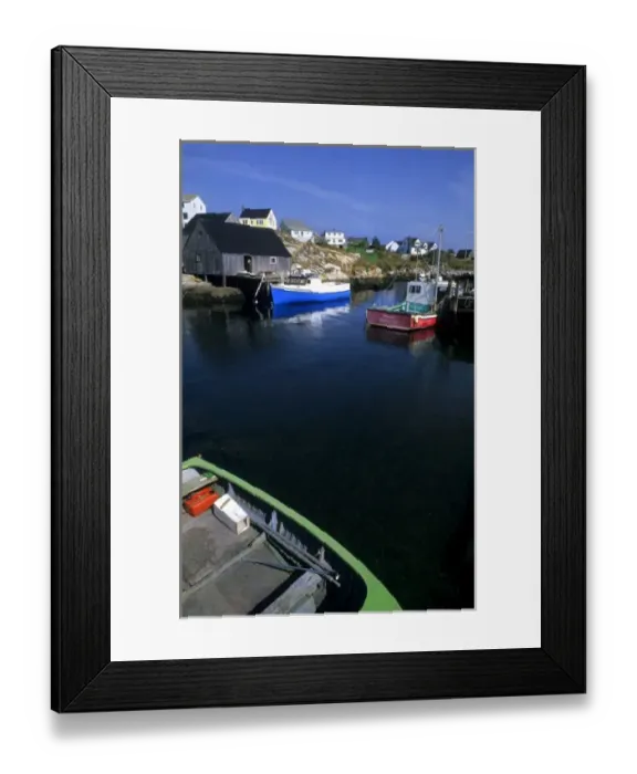 Framed Print : Beautiful village of Peggys Cove with harbor and fishing sheds in Nova Scotia Canada