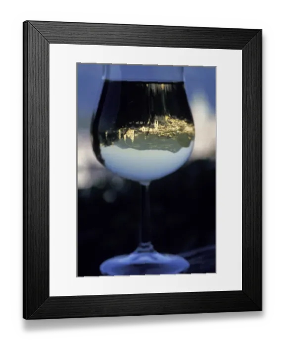 Framed Print : Austria, Salzburg. Old town architecture reflected in a wine glass