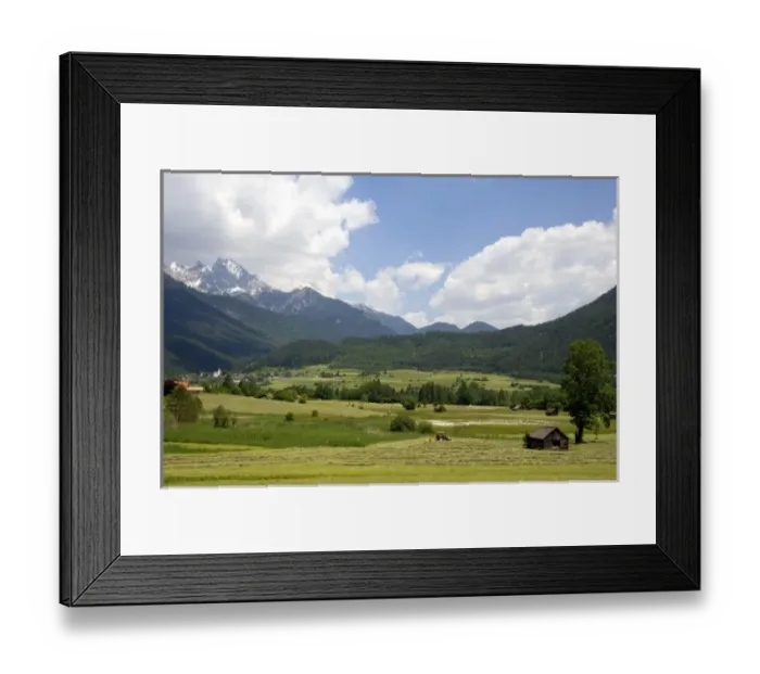 Framed Print : A tractor harvesting a hay field on a farm at Imst, Austria