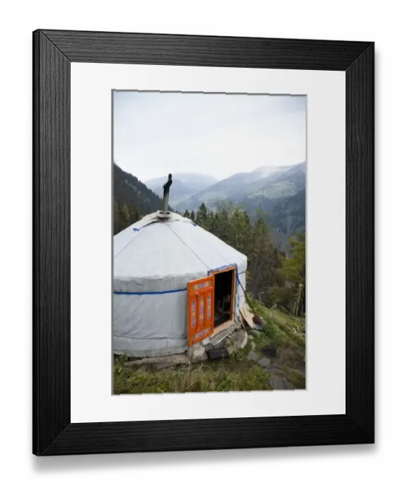 Framed Print : Austria - A small, rustic home in the mountains. The home is covered with and insulating material