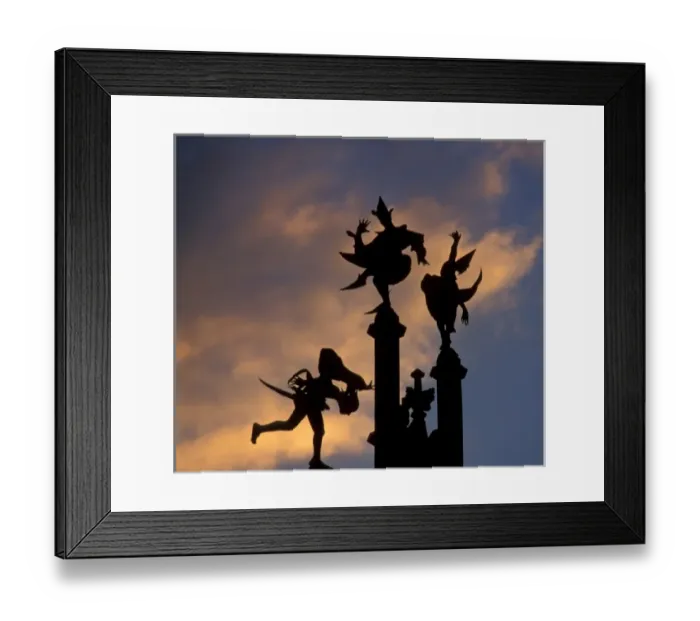 Framed Print : Belgium, Ghent. Silhouette of stone figures atop building, colored cloud background Framed Print : Belgium, Ghent. Silhouette of stone figures atop building, colored cloud background