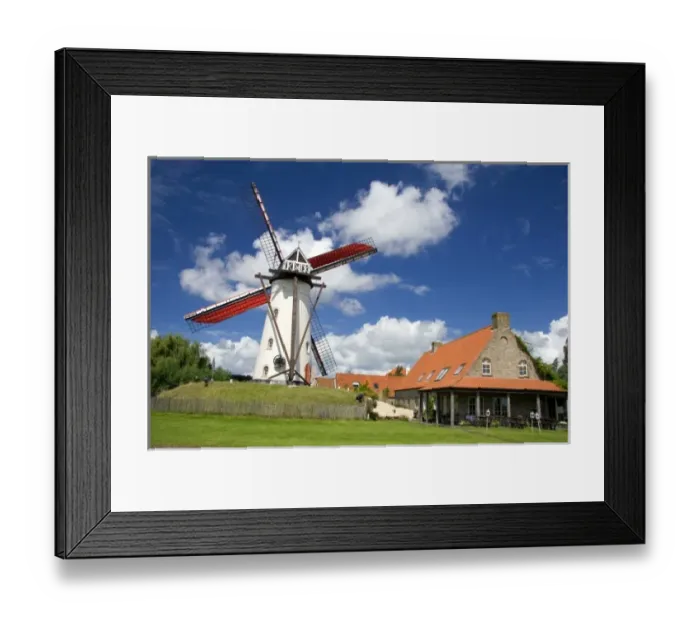 Framed Print : A windmill and old stone restaurant in the town of Ramskapelle in the municipality Framed Print : A windmill and old stone restaurant in the town of Ramskapelle in the municipality