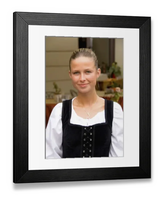 Framed Print : Close up of beautiful waitress in costume of tourist city of Cesky Krumlov in Czech Republic