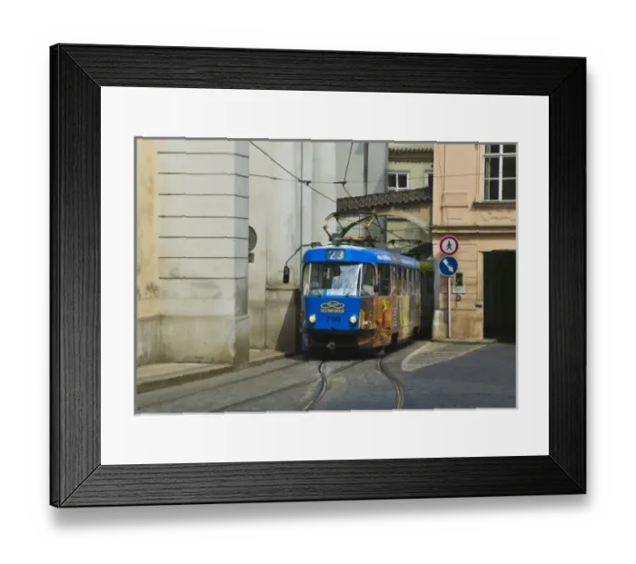Framed Print : Tram come out from arch under buildings in old town, Prague, Czech Republic