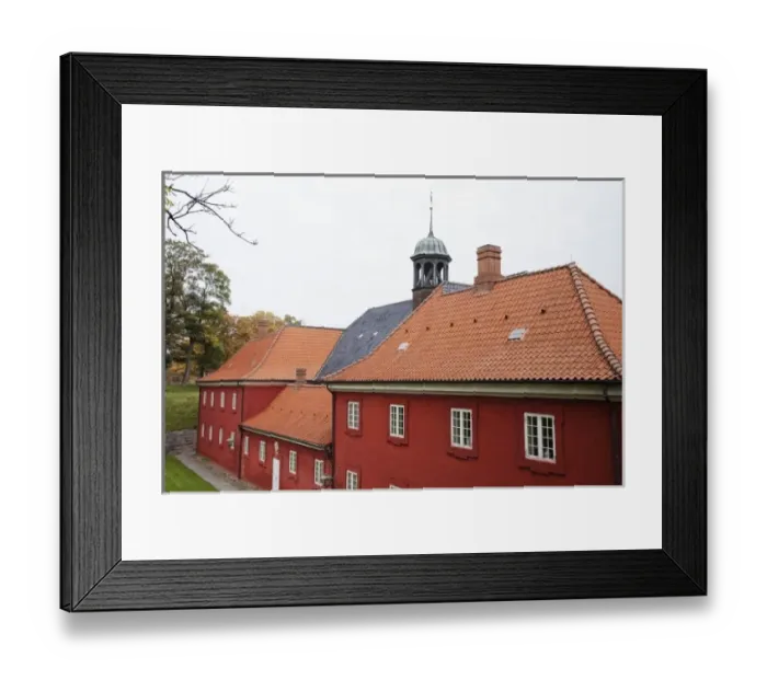 Framed Print : Copenhagen, Denmark - Red military barracks are surrounded by grass and trees Framed Print : Copenhagen, Denmark - Red military barracks are surrounded by grass and trees