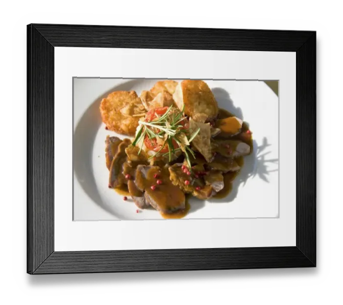 Framed Print : A dish of pork tenderloin and potato at a restaurant near Le Mont Saint Michel in
