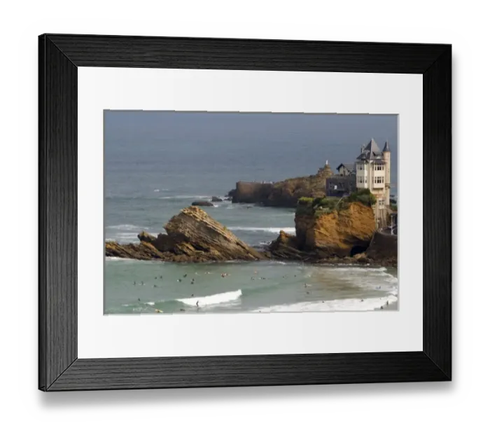 Framed Print : Surfing Cote de Basque below a castle in the Bay of Biscay at the town of Biarritz