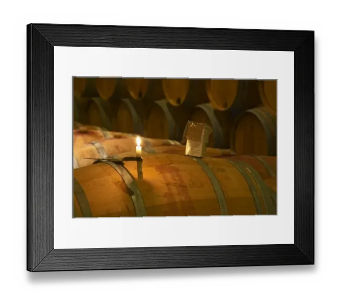 Framed Print : The winery, barrel aging cellar: a burning candle, a box of sulphur pellets - Chateau
