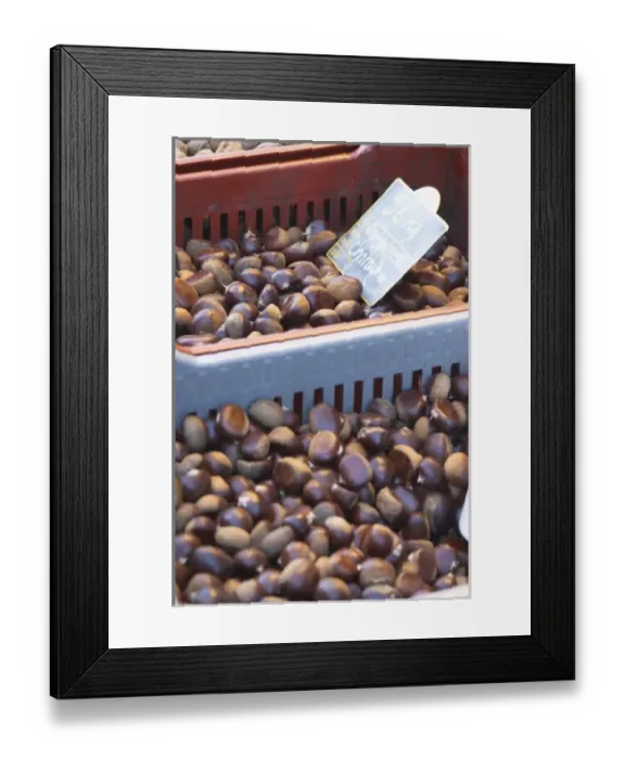 Framed Print : Chestnuts for sale at a market stall at the market in Bergerac in a red and grey plastic basket