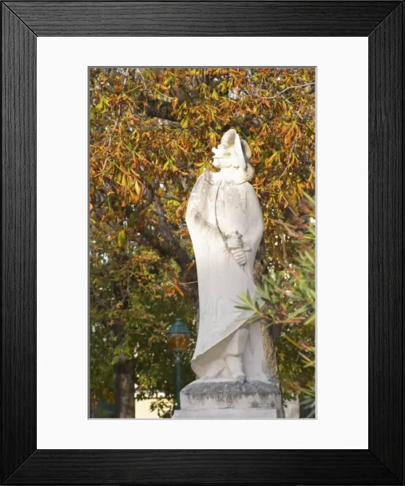 Framed Print : The old stone statue of Cyrano de Bergerac on a square in Bergerac. on Place de la Myrpe Framed Print : The old stone statue of Cyrano de Bergerac on a square in Bergerac. on Place de la Myrpe