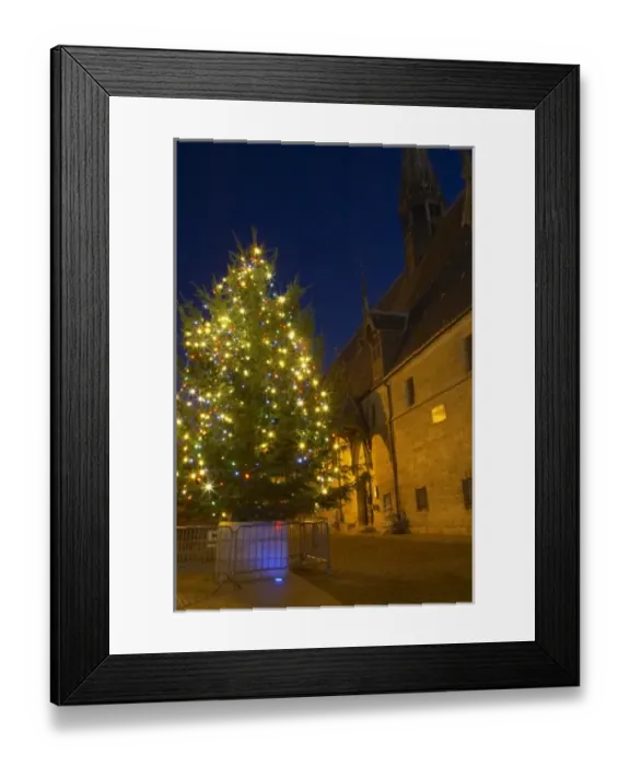 Framed Print : A chrstmas tree with coloured colored lights in front of the Hotel Dieu Hospices Framed Print : A chrstmas tree with coloured colored lights in front of the Hotel Dieu Hospices
