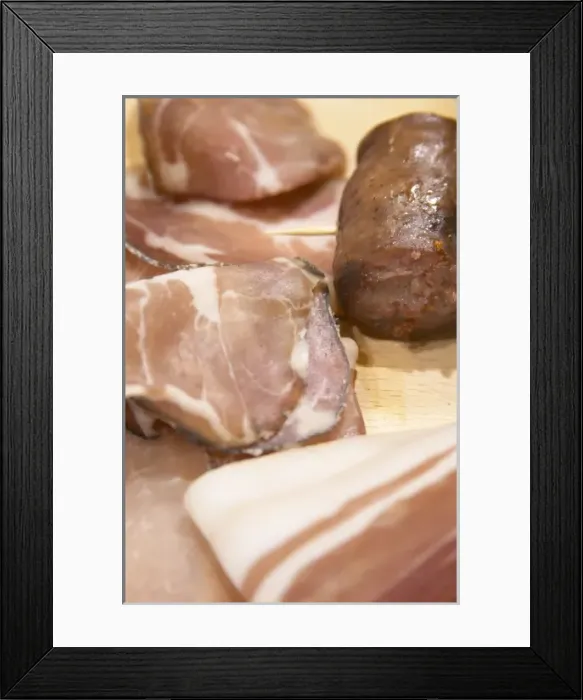 Framed Print : Corsica style charcuteries, smoked and dried ham, sausages on a wooden cutting board Framed Print : Corsica style charcuteries, smoked and dried ham, sausages on a wooden cutting board