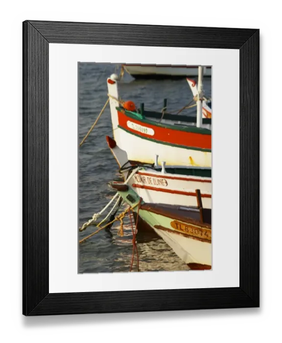 Framed Print : Typical Provencal fishing boats painted in bright colours white, blue, green red yellow Framed Print : Typical Provencal fishing boats painted in bright colours white, blue, green red yellow