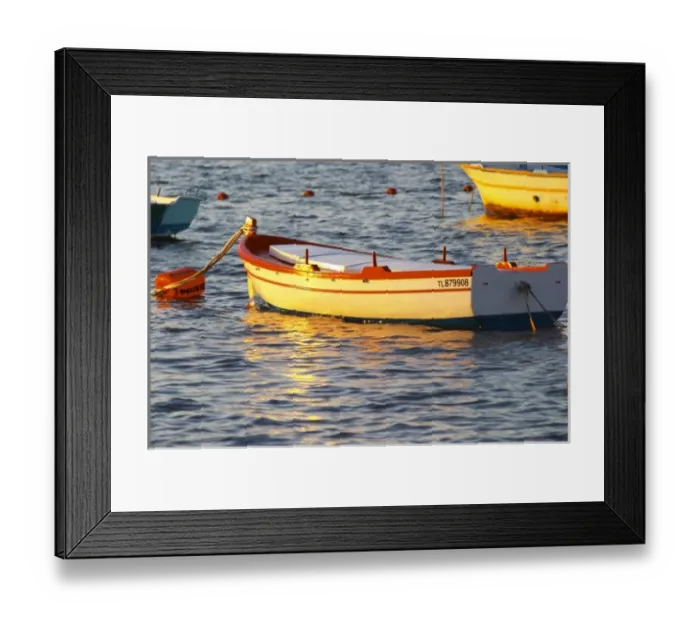 Framed Print : Typical Provencal fishing boats painted in bright colours white, blue, green red yellow Framed Print : Typical Provencal fishing boats painted in bright colours white, blue, green red yellow