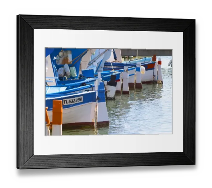 Framed Print : Typical Provencal fishing boats painted in bright colours white, blue, green red yellow Framed Print : Typical Provencal fishing boats painted in bright colours white, blue, green red yellow