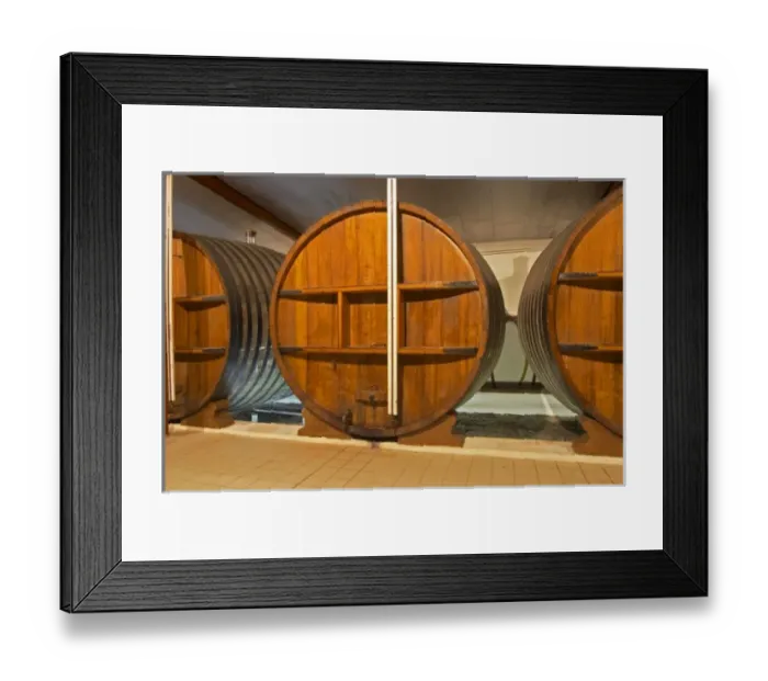 Framed Print : A storage room in the winery with old wooden foudres (large wooden barrels) Chateau Framed Print : A storage room in the winery with old wooden foudres (large wooden barrels) Chateau