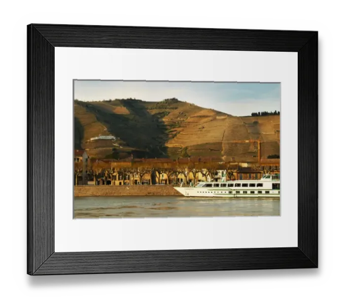 Framed Print : A view across the river from Tournon with a river cruise boat moored in Tain Framed Print : A view across the river from Tournon with a river cruise boat moored in Tain