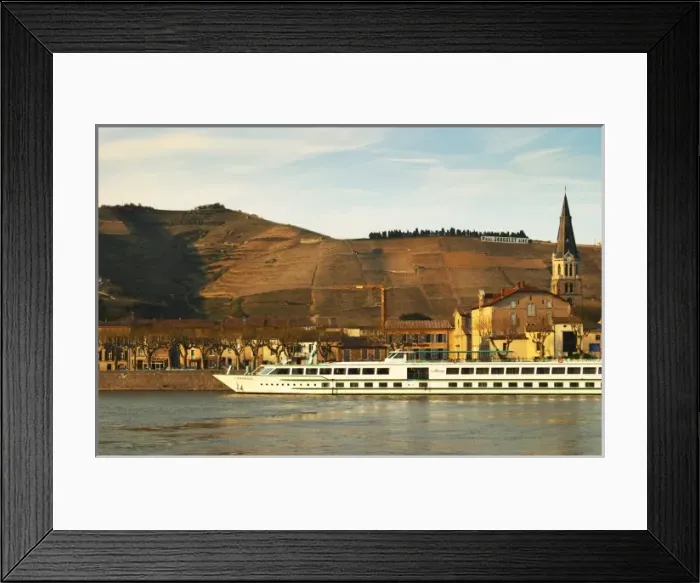 Framed Print : A view across the river from Tournon with a river cruise boat moored in Tain Framed Print : A view across the river from Tournon with a river cruise boat moored in Tain