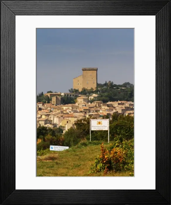 Framed Print : Village with the ruined chateau on top of the hill, the terracotta roof tops and houses