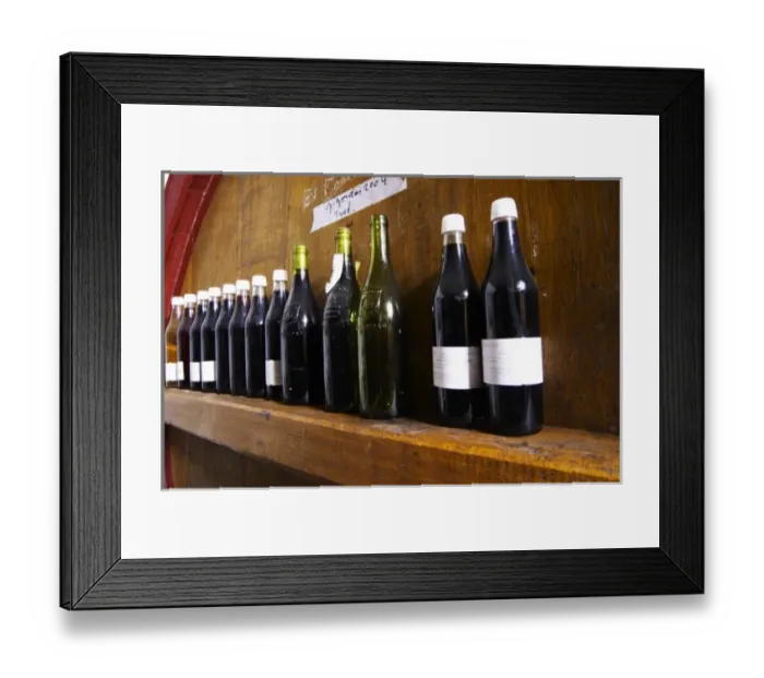 Framed Print : Storage vats for aging with sample bottles of wine on the cross bar. Domaine la Tourade Framed Print : Storage vats for aging with sample bottles of wine on the cross bar. Domaine la Tourade