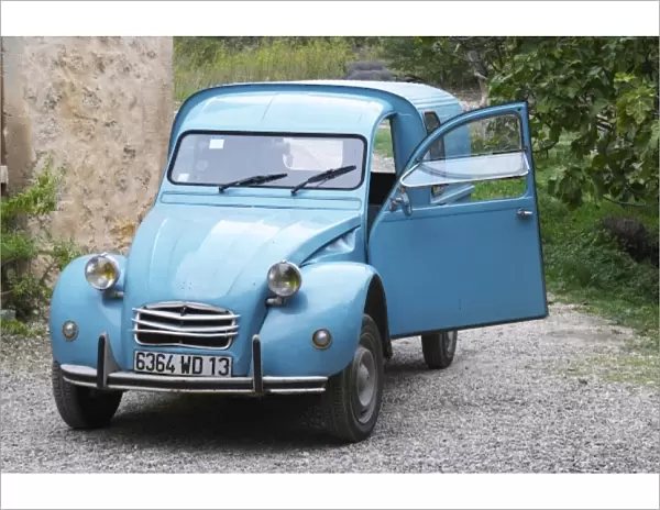A blue old Citroen 2CV 2 CV converted into a transport van. Moulin Mas des Barres olive mill