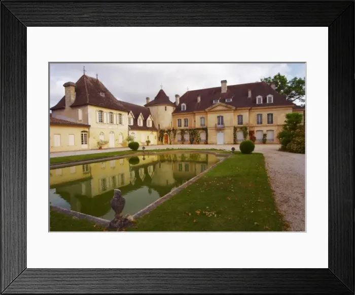 Framed Print : The main chateau building with its tower and a pond showing a reflection Chateau