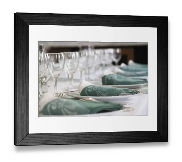 Framed Print : Table set in traditional style, white plates with golden decoration, white and green linen napkins
