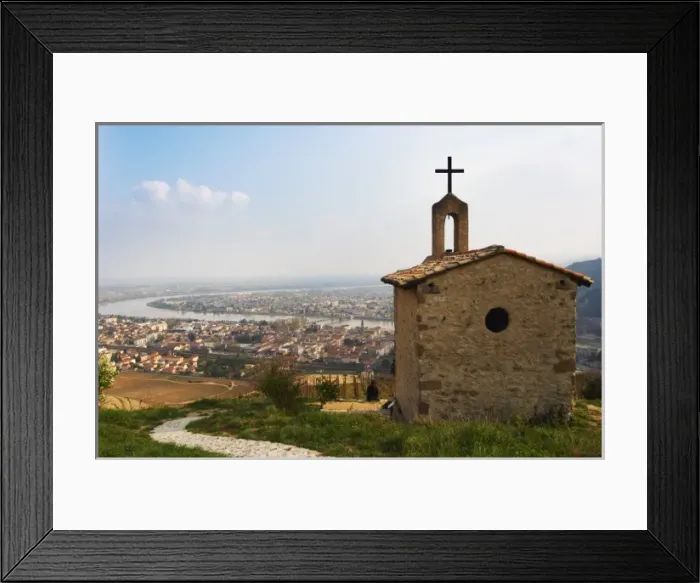 Framed Print : The Hermitage chapel on top of the hill with a view across the river on Tournon
