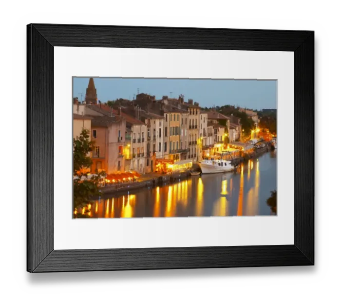 Framed Print : Restaurants along the l Herault river. L Herault river. A fishing boat. Agde town Framed Print : Restaurants along the l Herault river. L Herault river. A fishing boat. Agde town