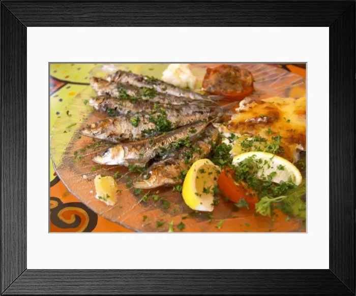 Framed Print : Collioure. Roussillon. Grilled sardines with potato gratin. France. Europe