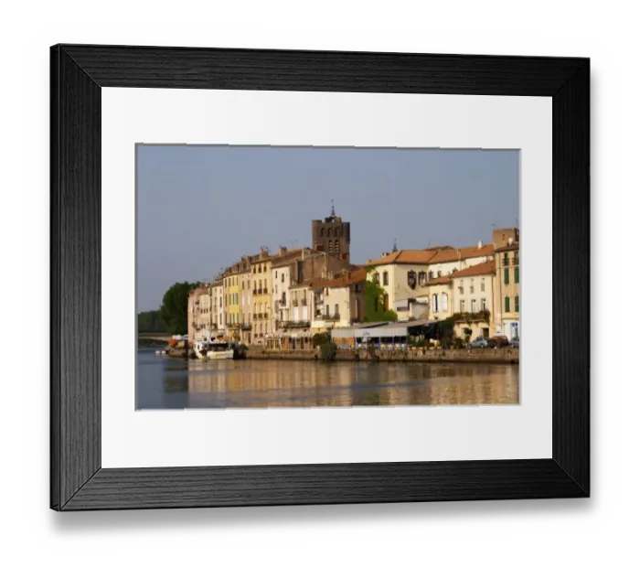 Framed Print : Restaurants along the l Herault river. L Herault river. Agde town. Languedoc