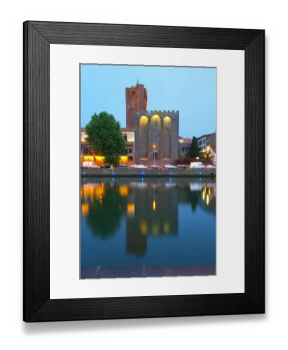 Framed Print : The black basalt lava stone cathedral. The La Galeote hotel. L Herault river