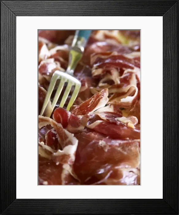 Framed Print : Domaine de Nidoleres. Roussillon. A plate of dry cured ham with a serving fork. France