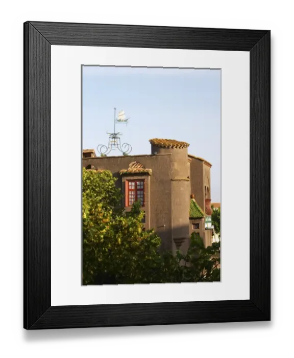 Framed Print : The La Galeote hotel. Weather vane in the form of a sailing ship with indication