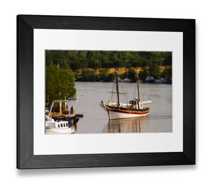 Framed Print : L Herault river. A fishing boat. Agde town. Languedoc. France. Europe Framed Print : L Herault river. A fishing boat. Agde town. Languedoc. France. Europe