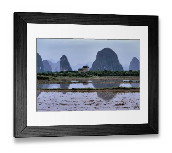 Framed Print : Asia, China, Guilin. A lone house oversees ponds by the karst formations near Guilin