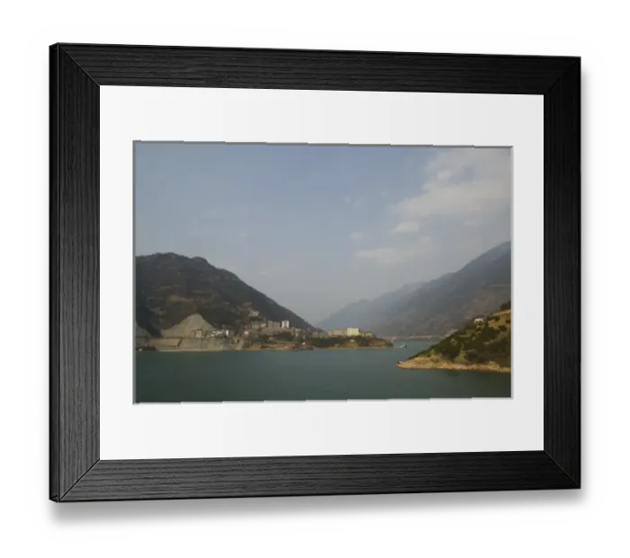 Framed Print : CHINA, Hubei Province. Yangzi River Town from Cruise Ship north of Xiling Gorge Framed Print : CHINA, Hubei Province. Yangzi River Town from Cruise Ship north of Xiling Gorge