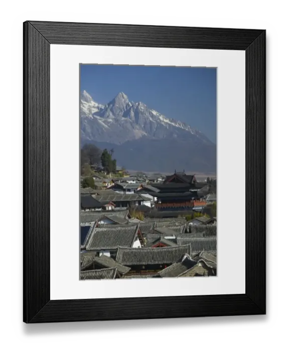 Framed Print : CHINA, Yunnan Province, Lijiang. Old Town, Rooftops and Jade Dragon Snow Mountain from New Town Framed Print : CHINA, Yunnan Province, Lijiang. Old Town, Rooftops and Jade Dragon Snow Mountain from New Town