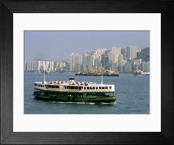 Framed Print : Star Ferry and skyscraper buildings at Hong Kong Harbor Framed Print : Star Ferry and skyscraper buildings at Hong Kong Harbor