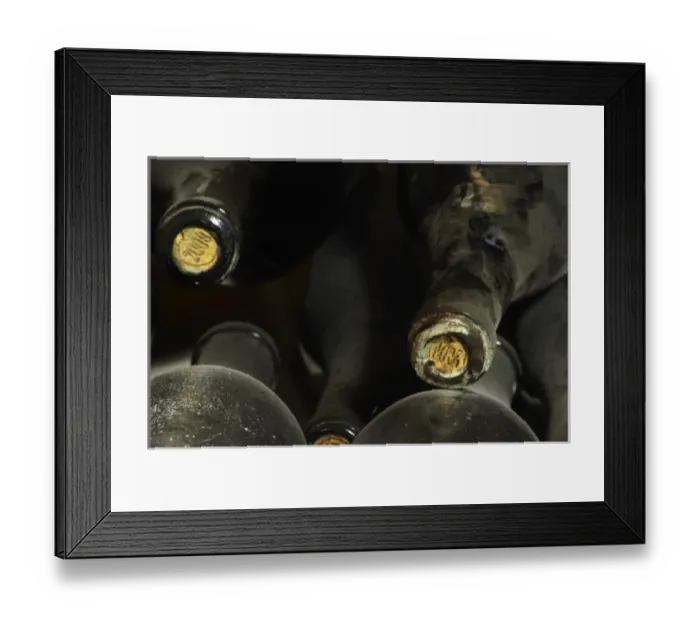 Framed Print : 2000 stamped on the cork on old dusty bottles. Domaine Cazeneuve in Lauret. Pic St Loup Framed Print : 2000 stamped on the cork on old dusty bottles. Domaine Cazeneuve in Lauret. Pic St Loup