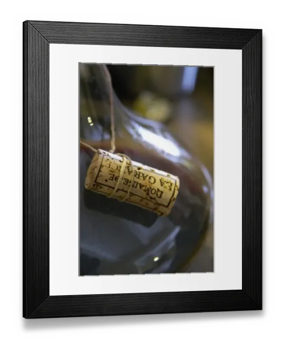 Framed Print : The cork tied in a sting around the neck of the decanter. Domaine de la Garance. Pezenas region Framed Print : The cork tied in a sting around the neck of the decanter. Domaine de la Garance. Pezenas region