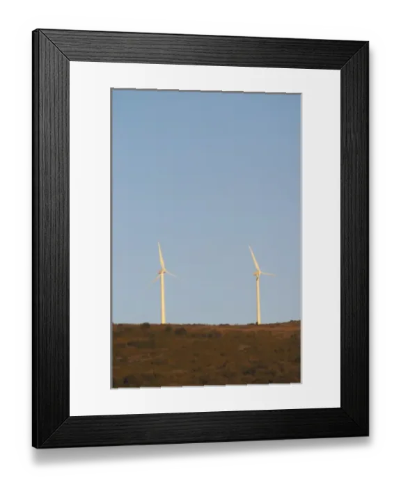 Framed Print : Wind power turbines on a mountain hill top crest against a blue sky. Limoux. Languedoc Framed Print : Wind power turbines on a mountain hill top crest against a blue sky. Limoux. Languedoc