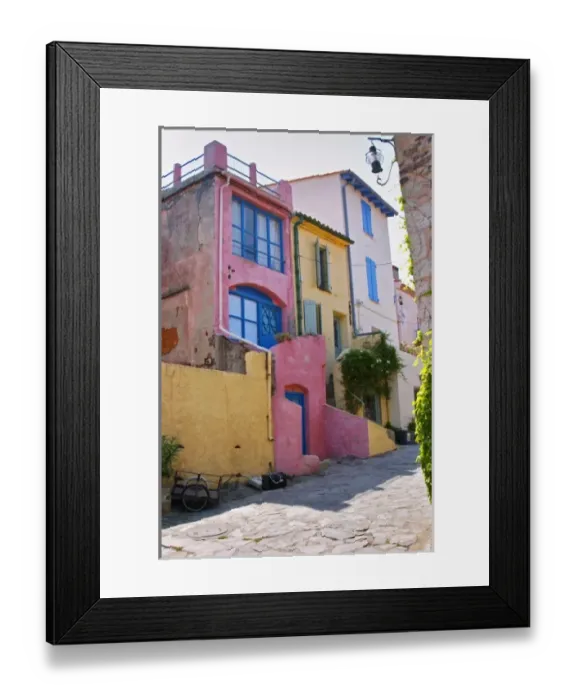 Framed Print : A narrow street in the old town. Collioure. Roussillon. France. Europe. Colourful houses Framed Print : A narrow street in the old town. Collioure. Roussillon. France. Europe. Colourful houses