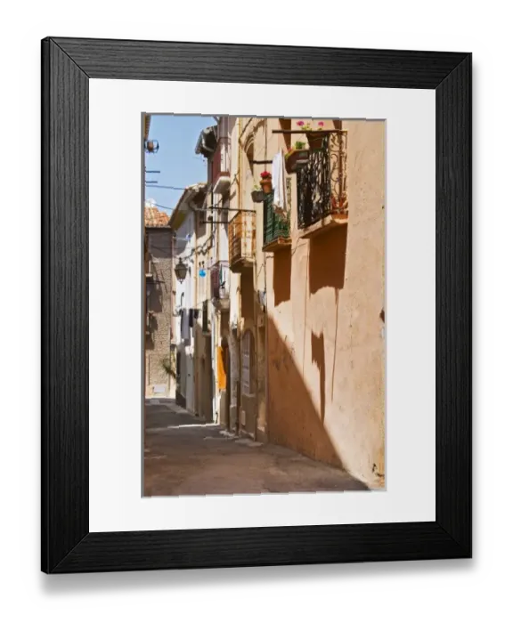 Framed Print : Narrow village street. Bouzigues Languedoc. France. Europe Framed Print : Narrow village street. Bouzigues Languedoc. France. Europe