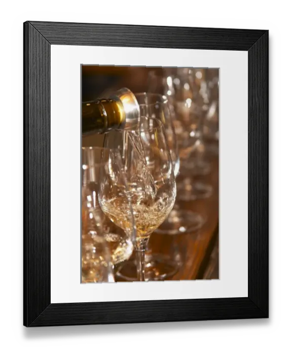 Framed Print : Pouring a glass of George Vernays Condrieu at a wine tasting. Glass with silver Framed Print : Pouring a glass of George Vernays Condrieu at a wine tasting. Glass with silver