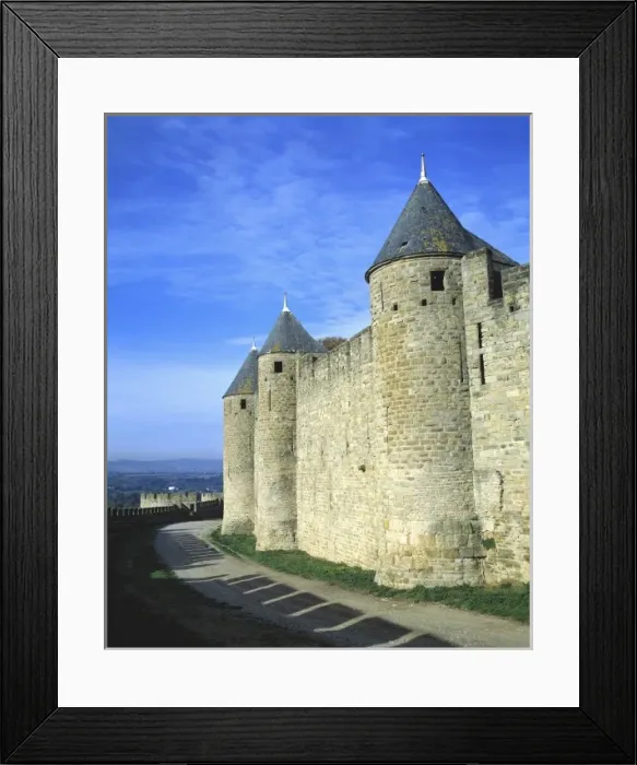 Framed Print : Europe, France, Carcassonne. Shadows of the crenelatted walls shade the pathway under