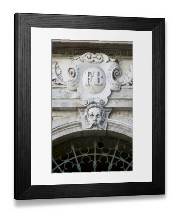 Framed Print : France, Corsica. Grotesque face and ornate decoration on pediment above door in Ajaccio Framed Print : France, Corsica. Grotesque face and ornate decoration on pediment above door in Ajaccio
